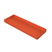 A rectangular, shallow tray with raised edges, made of solid orange material. Simple and modern in design, this dishwasher safe bowl is photographed on a white background.