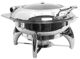 A shiny 6 Quart Stainless Steel Chafer with a domed lid and curved handles stands on three arched legs. This round dish, ideal for buffets or catered events, keeps food warm. The lid features a small knob on top.