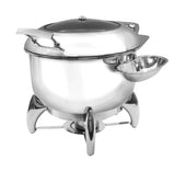 A polished stainless steel Soup Chafer Dish with a domed lid, sturdy handles, and a small attached bowl on the right. It stands on three curved legs with a fuel powered holder below to keep food warm and its surface shines brilliantly.