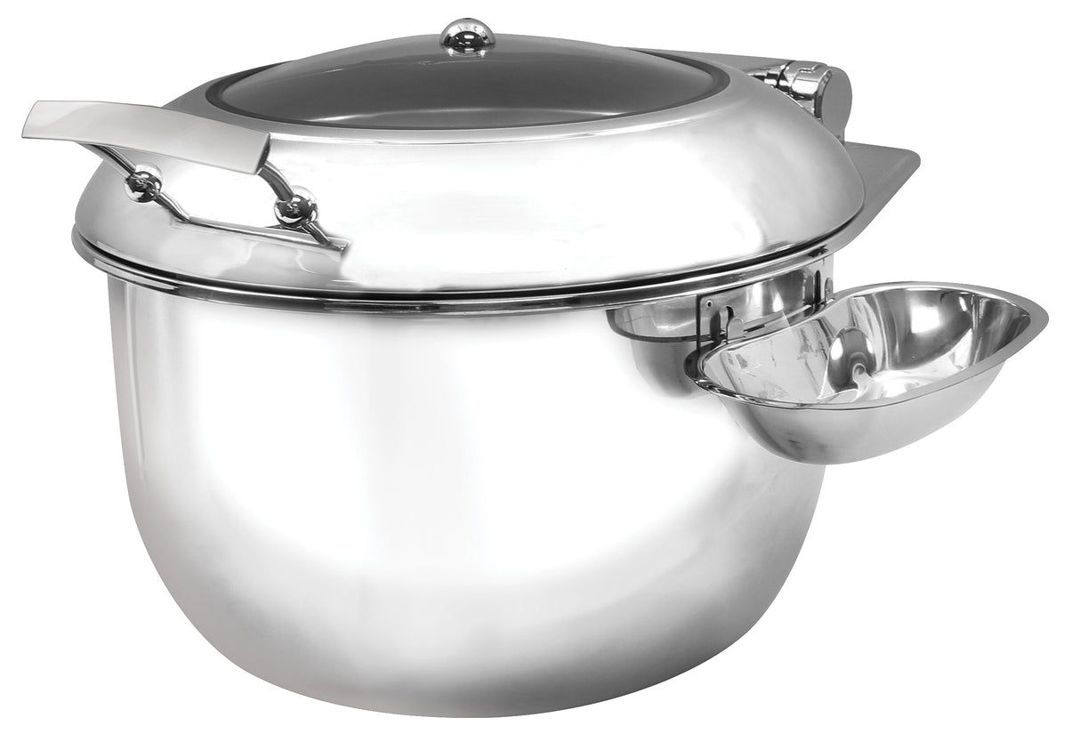 A shiny 9 qt. stainless steel Induction Soup Chafing Dish with a rounded body, domed lid handle, and attached side bowl. Its modern design features a reflective surface and comes with a ladle resting on the side attachment.