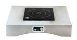 A stainless steel TableCraft Products countertop induction cooktop features a single black induction burner with circular heating zone markings. The front panel includes a control knob and buttons for adjusting settings. The background is plain white.