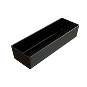 A rectangular, deep black cast aluminum bowl with high sides and a glossy finish, featuring subtle white speckles throughout. The empty bowl is pictured against a white background, emphasizing its smooth and reflective surface.