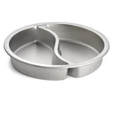 A round stainless steel baking pan with a raised divider in the center, splitting it into two curved sections. The shiny, smooth surface is dishwasher safe, making this Replacement Food Pan ideal for baking two cakes or items at once.