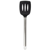 A serving spatula with a long, stainless steel handle and a black, wide, slotted silicone head featuring three vertical holes. The handle includes a small metal loop for hanging. The spatula is set against a plain white background.