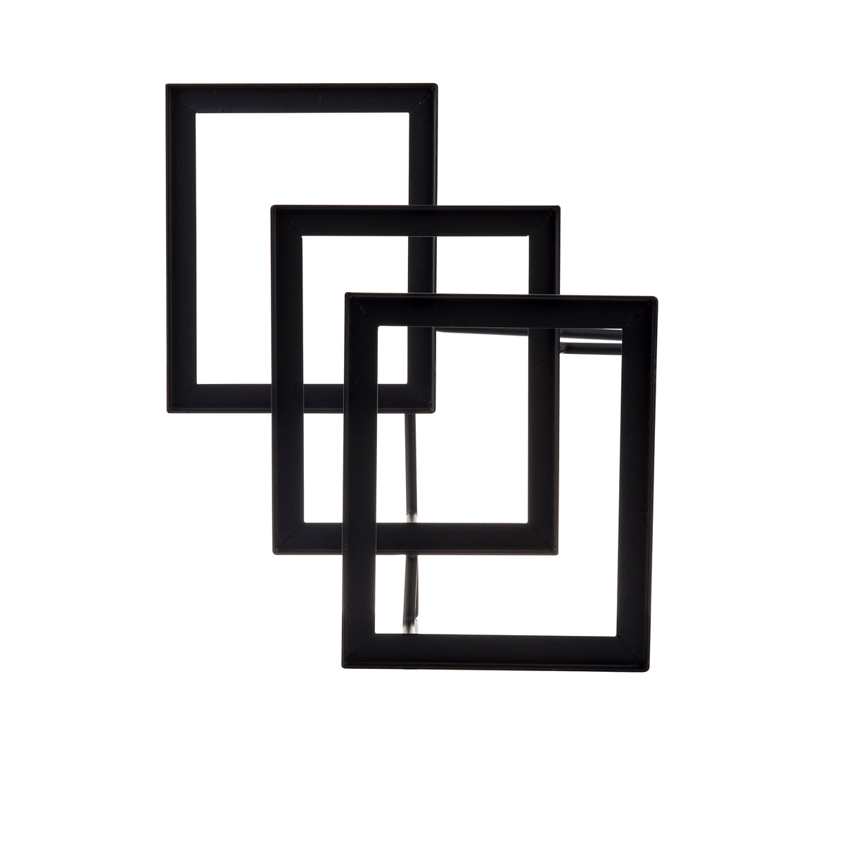 Three black, empty rectangular frames are arranged in a staggered, overlapping pattern like a minimalist steel stand. The upright frames create depth as they rest against a plain white background, each one partially inside the next.