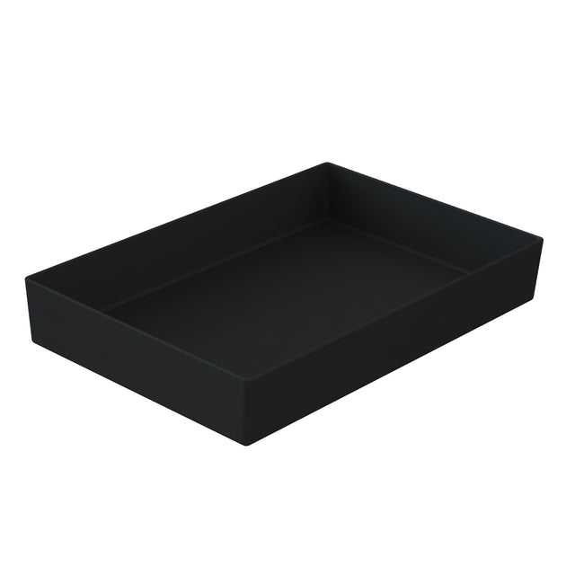 A plain black rectangular tray with slightly raised edges, viewed at an angle against a white background. The tray, reminiscent of a cast aluminum bowl, features a smooth, matte finish for a minimalist and modern look.