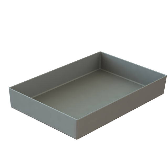 A rectangular, shallow cast aluminum bowl with straight, smooth sides and a matte grey finish is shown on a white background. The tray appears empty and is viewed at an angle, revealing its depth and clean, minimalist design.