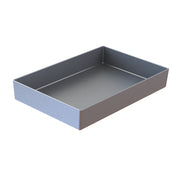 A rectangular, metallic tray with straight sides and sharp corners, viewed at an angle from above. Crafted from cast aluminum, the tray has a smooth, matte surface and is empty, placed against a plain white background.