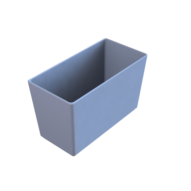 A simple, empty rectangular cast aluminum bowl with straight sides and rounded corners, shown from a slightly elevated angle. The light blue, smooth container sits on a plain white background and is dishwasher safe.