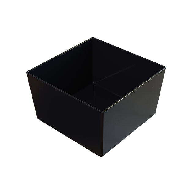 A plain, glossy black cast aluminum bowl with straight sides and sharp corners, viewed from a slightly angled perspective showing the interior. The container sits on a white background, casting a soft shadow.