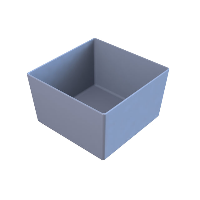 A simple, plain, light gray cast aluminum bowl with straight sides and an open top, shown on a white background. The bowl appears empty and is viewed from an elevated angle, revealing its interior and sharp edges.