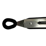 A close-up of a metal utility knife with a stainless steel handle cutting through a black, oval-shaped rubber band on a white background. The blade is partially extended, positioned precisely at the point where it severs the band.