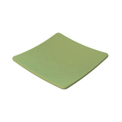 A square, light green ceramic plate with gently curved edges and a glossy finish, set against a plain white background. This minimalistic and modern design is also dishwasher safe for easy cleaning.