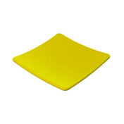 A square, bright yellow ceramic plate with slightly upturned edges is shown on a plain white background. The plate’s glossy surface reflects light and is dishwasher safe, giving it a smooth and modern appearance.