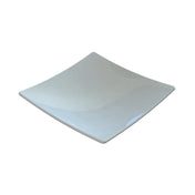 A square, white ceramic plate with gently curved edges and a glossy finish, displayed on a plain white background. The plate's surface reflects light, creating subtle highlights and shadows reminiscent of the Sierra Collection Bowl.