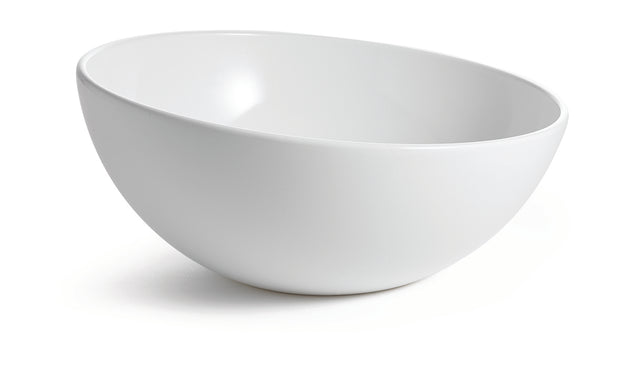 A plain, white, empty cold holding bowl is positioned at an angle on a white background. The bowl has smooth, clean lines and a glossy finish, with shadows underneath emphasizing its round shape.