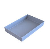 A light blue, rectangular plastic tray with smooth sides and no handles, viewed from a slightly elevated angle against a plain white background. The dishwasher safe tray is empty and features a simple, modern design.
