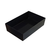 A plain, rectangular black box with straight sides and an open top resembles a Simple Solutions Bowl, featuring smooth Duracoat coated cast aluminum surfaces inside and out. There are no visible handles, lids, or decorative elements.