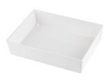 A plain, rectangular, white ceramic dish with high sides is shown on a white background. Reminiscent of a Simple Solutions Bowl, it features smooth, glossy surfaces and clean, sharp edges. The image is taken from an angled, slightly top-down perspective.