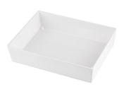A plain, rectangular, white ceramic dish with high sides is shown on a white background. Reminiscent of a Simple Solutions Bowl, it features smooth, glossy surfaces and clean, sharp edges. The image is taken from an angled, slightly top-down perspective.