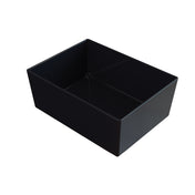 A rectangular, black Simple Solutions Bowl with smooth sides and slightly rounded edges sits empty on a white background, viewed from an angle above and to the side.