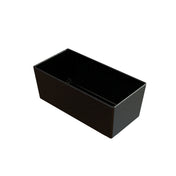 A rectangular black loaf pan with slightly flared sides and a glossy finish, shown on a white background. Unlike a cast aluminum bowl, this pan is ideal for baking bread or cakes and delivers simple solutions for home bakers.