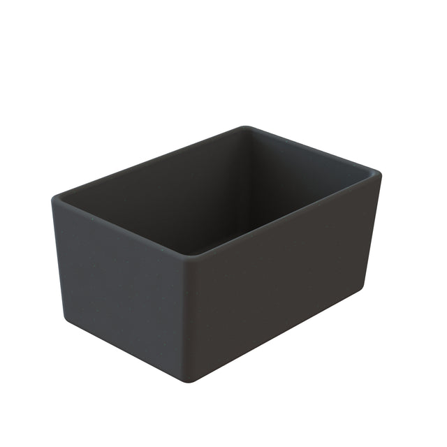 A rectangular, matte black Simple Solutions™ Bowl made of Duracoat™ coated cast aluminum with a smooth surface and slightly rounded edges. The empty bowl’s modern design is displayed angled on a plain white background.