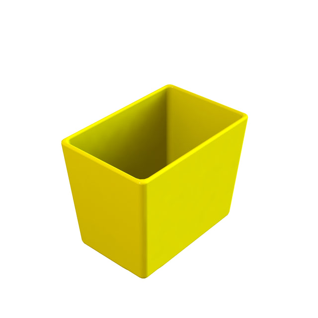 A bright yellow, rectangular Simple Solutions Bowl with smooth sides and an open top is shown against a plain white background. The container appears empty and is angled, showing both its depth and width.