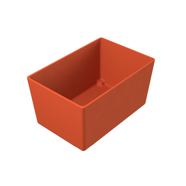 A rectangular, orange, open-top Simple Solutions Bowl with smooth sides and slightly rounded edges, viewed from an angle above and to the side, showing the NSF-listed interior against a white background.