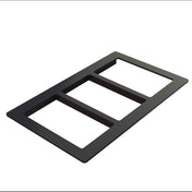 A black, rectangular, three-gang wall plate with three open slots, made from Duracoat coated cast aluminum for durability. Viewed at an angle against a white background, it’s designed to cover and organize three wall switches or outlets.