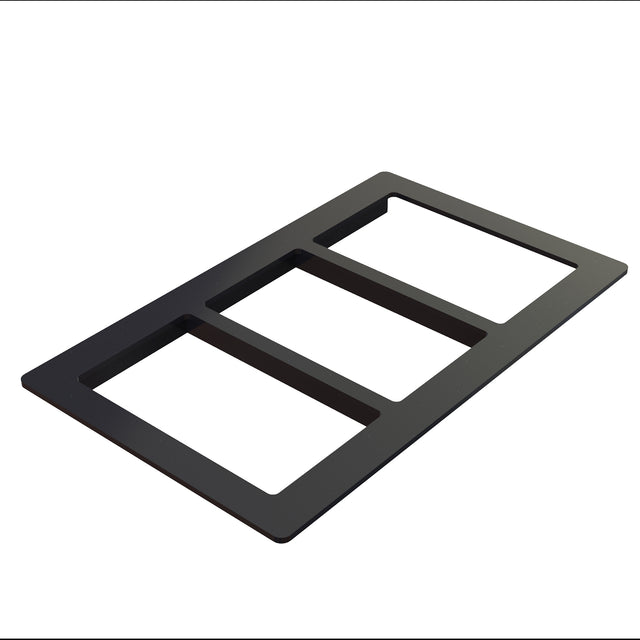 A black, rectangular, three-gang wall plate with three open slots, made from Duracoat coated cast aluminum for durability. Viewed at an angle against a white background, it’s designed to cover and organize three wall switches or outlets.