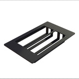 A rectangular, flat black Duracoat coated cast aluminum object with two large open slots and three connecting bars, isolated on a white background. The minimalist geometric design suggests use as a NSF-7 Cold Food Template or mounting plate for components.