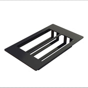 A rectangular, flat black Duracoat coated cast aluminum object with two large open slots and three connecting bars, isolated on a white background. The minimalist geometric design suggests use as a NSF-7 Cold Food Template or mounting plate for components.