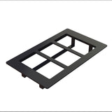 A black rectangular Duracoat coated cast aluminum switch plate cover with three rectangular cutouts for switches or outlets, shown on a white background at an angle, revealing its thickness and four supporting tabs underneath.