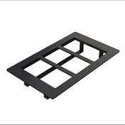 A black rectangular Duracoat coated cast aluminum switch plate cover with three rectangular cutouts for switches or outlets, shown on a white background at an angle, revealing its thickness and four supporting tabs underneath.