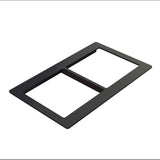 A black rectangular switch plate with two large openings, viewed at an angle on a white background. Crafted from Duracoat coated cast aluminum, it’s designed to frame and cover two electrical switches or outlets.