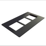 A black Duracoat coated cast aluminum faceplate with three rectangular cutouts, shown at an angle on a white background. The plate is flat with rounded edges and a smooth surface, designed for mounting electrical switches or outlets.