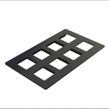 A black rectangular Duracoat coated cast aluminum plate with eight evenly spaced square cutouts arranged in two rows of four, lying on a white background and viewed at an angle—ideal as a cold food template.