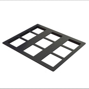 A black aluminum rectangular frame with nine evenly spaced rectangular cutouts, resembling a cold food template, is arranged in a 3x3 grid on a white background. The frame is lying flat and viewed from an angled perspective.