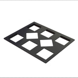 A flat, black Duracoat coated cast aluminum rectangular sheet with eight cut-out rectangles in two rows of four; the two center cut-outs are rotated to form diamonds, while the others are upright rectangles. Ideal as a Cold Food Template. White background.