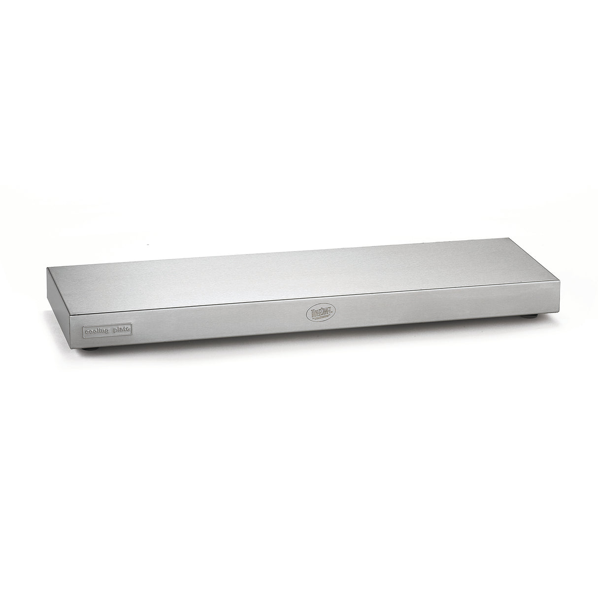 A rectangular, stainless steel warming tray by TableCraft with a smooth, flat top. A label on the left corner reads "warming plate," and a circular logo is centered on the front. The tray sits on a white surface against a plain white background.