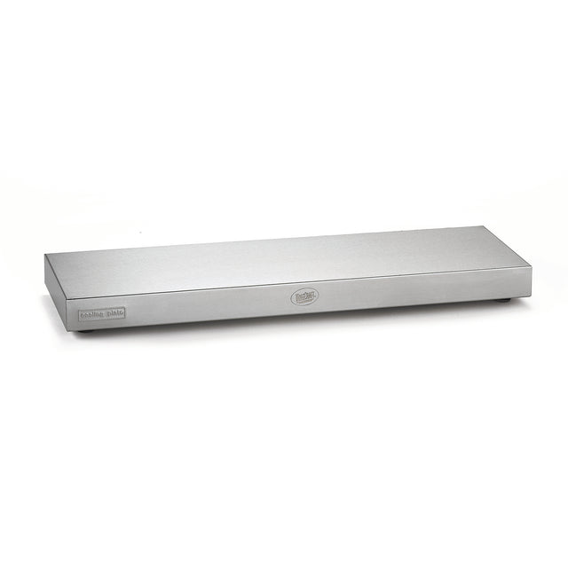 A rectangular, stainless steel warming tray by TableCraft with a smooth, flat top. A label on the left corner reads "warming plate," and a circular logo is centered on the front. The tray sits on a white surface against a plain white background.