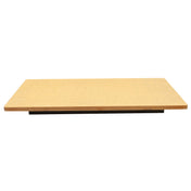 A rectangular, flat Versa-Tile Carving Station with smooth edges is shown against a white background. The board appears to be made of light brown wood or particleboard and is positioned horizontally, photographed from a low, straight-on angle.