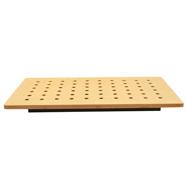A rectangular wooden Versa-Tile Carving Station with evenly spaced round holes in a grid pattern, viewed from the front. The board has smooth edges and is raised above a black base, making the holes clearly visible.