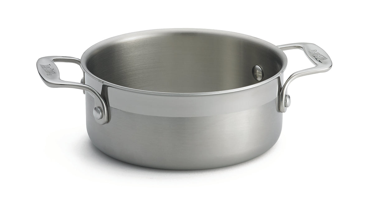 A shiny stainless steel tri-ply casserole pot with two sturdy handles rests on a white surface. The empty pot's smooth brushed finish and reflective, clean surfaces are secured by bolts, making it perfect as a dishwasher safe casserole.
