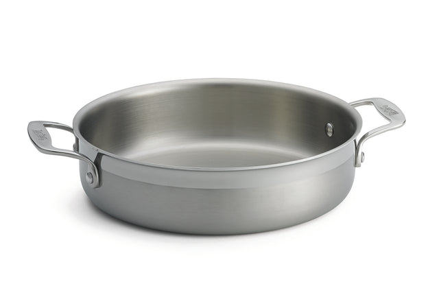A tri-ply stainless steel Brazier Pan with two sturdy handles, one on each side. Its wide, flat base and high sides offer even heating, while the smooth, reflective surface is induction safe. The pan is shown without a lid against a plain white background.