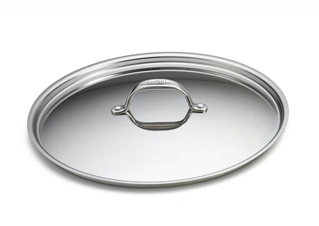 A shiny, tri-ply stainless steel lid for CW7014 with a curved handle sits on a plain white background. The oval-shaped, reflective lid features a smooth, polished surface and a small engraved brand name near the handle’s base.