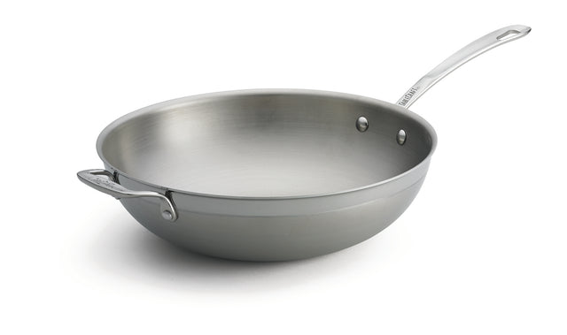 A tri-ply wok with a shiny stainless steel finish, featuring a wide, rounded base and tall sides. It includes a long handle and a riveted helper handle for stability—plus, this dishwasher safe wok is set against a white background.