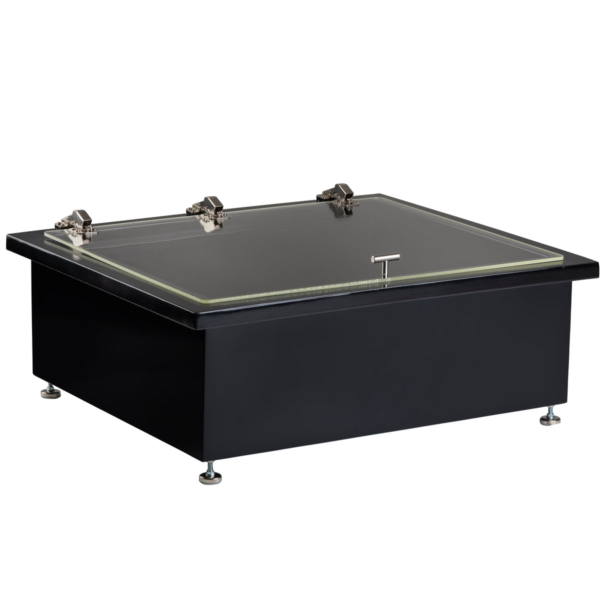 A black, rectangular laboratory glove box with a sleek black brushed finish and an acrylic lid secured by three metal latches. It sits on four adjustable metal feet and features a front handle for easy opening, emphasizing its modern, industrial appeal.