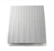 A rectangular sheet of Duracoat coated cast aluminum with a repeating circular swirl pattern covers the surface. The light gray, reflective metal is dishwasher safe and placed on a plain white background with soft shadows around the edges.